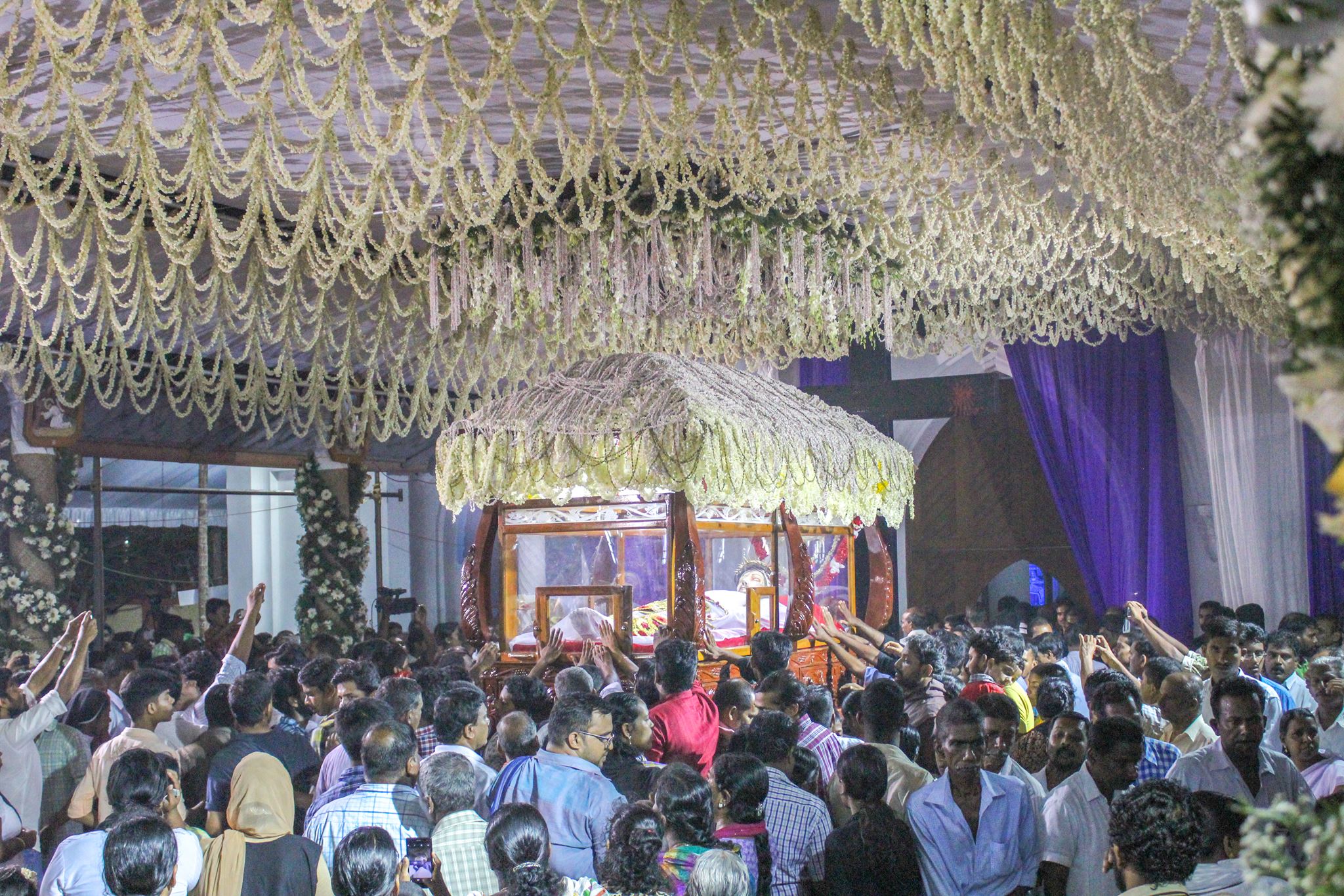 The statue decorated for a feast day at Thankey Church
